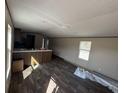 Open-concept living space featuring modern wood flooring, cabinetry, and abundant natural light at 2500 Newton Rd., Aynor, SC 29511