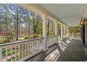 The spacious front porch, adorned with columns, offers great view of the landscaped surroundings at 4569 Carriage Run Circle, Murrells Inlet, SC 29576