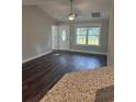 Welcoming entryway with a decorative front door, large window, and dark hardwood floors at Tbd2 Privetts Rd., Conway, SC 29526