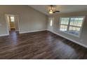 Spacious room with dark wood floors and a large window providing natural light at Tbd2 Privetts Rd., Conway, SC 29526