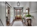 Bright entryway with hardwood floors, barn door, and console table at 1055 Academy Dr., Conway, SC 29526