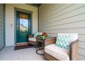 Inviting front porch with two wicker chairs, providing a relaxing spot at 1926 Bluff Dr., Myrtle Beach, SC 29577