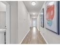 Bright hallway with light wood floors and modern art at 2020 Santa Maria St., Myrtle Beach, SC 29579