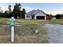 New construction home with a lot sign in a spacious lot and under construction at 108 Infinity Ln., Loris, SC 29569