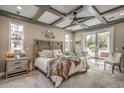 Bright bedroom with a coffered ceiling and sliding glass doors at 405 N Highland Way, Myrtle Beach, SC 29572