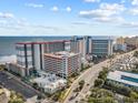 Aerial view of the resort buildings with views of the coastline and adjacent roadway at 7200 Ocean Blvd. N # 254, Myrtle Beach, SC 29572