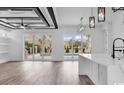 Bright open-concept living area with views of the pool and patio through sliding glass doors at 835 Waterton Ave., Myrtle Beach, SC 29579