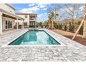 Inviting pool area with beautiful stone pavers and a spa, perfect for relaxation and entertaining at 835 Waterton Ave., Myrtle Beach, SC 29579