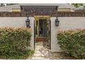 Inviting entryway with wrought iron gate and brick wall accents at 11 Valencia Circle, Myrtle Beach, SC 29572