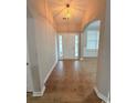 Inviting foyer with tile flooring, transom windows, and a view into the adjacent room at 2549 Sugar Creek Ct., Myrtle Beach, SC 29579