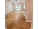 Spacious living room with wood-look floors, neutral walls, and ample natural light at 2549 Sugar Creek Ct., Myrtle Beach, SC 29579