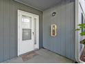 Welcoming front door with storm door, 