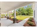 Covered porch with stone pillars offering a view of the neighborhood at 790 Caines Landing Rd., Conway, SC 29526