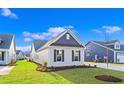 Side view of house showcasing siding and landscaping at 284 Starlit Way, Myrtle Beach, SC 29579