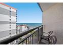 A serene balcony featuring comfortable chairs and a stunning ocean view at 7100 N Ocean Blvd. # 1023, Myrtle Beach, SC 29572