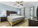 King-size bed, nightstands, and TV in a condo bedroom at 2007 S Ocean Blvd. # 1405, Myrtle Beach, SC 29577