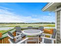 Relaxing deck overlooking tranquil marsh views at 209 N Dogwood Dr., Garden City Beach, SC 29576