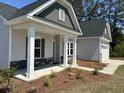 Charming single-story home boasting a welcoming porch and well-maintained landscaping at 2275 King Farm Rd., Aynor, SC 29511