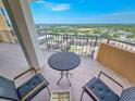 This balcony features a stunning view of the community, complete with a table and chairs at 9650 Shore Dr. # 1906, Myrtle Beach, SC 29572