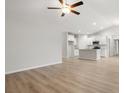 Open living area with vinyl plank flooring and a view into the kitchen at 1130 Cypress Shoal Dr., Conway, SC 29526