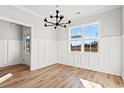 Bright dining room with wainscoting and a large window at 1409 Crooked Hook Rd., North Myrtle Beach, SC 29582