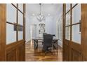 Charming office with hardwood floors, built-in shelves, desk, and a modern lighting fixture at 9318 Cove Dr., Myrtle Beach, SC 29572