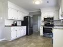 Bright kitchen with stainless steel appliances, granite counters and tiled floor at 104 Sprucewood Ct., Myrtle Beach, SC 29588