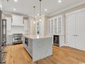 Bright kitchen featuring a large island, modern appliances, and ample cabinet space for storage at 8111 Laurel Ash Ave., Myrtle Beach, SC 29572