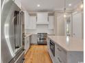 This kitchen features stainless steel appliances, custom cabinets, and a large center island at 8111 Laurel Ash Ave., Myrtle Beach, SC 29572