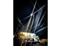Night view of a raised home, illuminated by a bright interior and outdoor spotlights at 100 Lure Ct., Conway, SC 29526
