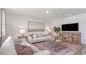 Cozy living room showcases stylish decor, plush seating, and a decorative area rug at 560 Duvall St., Longs, SC 29568