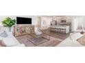 Inviting living room featuring open layout with seamless transition to kitchen area at 560 Duvall St., Longs, SC 29568