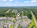 Expansive aerial view of condos in a lush community, ponds and a golf course nearby at 5810 Longwood Dr. # 14-304, Murrells Inlet, SC 29576
