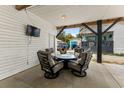 Cozy outdoor patio area with comfortable seating, a table, and a mounted TV for entertainment at 6001 - N14 S Kings Hwy., Myrtle Beach, SC 29575