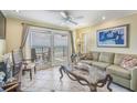 Bright living room with ocean view and comfy seating at 517 S Ocean Blvd. # 605, North Myrtle Beach, SC 29582