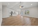 Spacious living room featuring hardwood floors, recessed lighting, and an open floor plan that connects to the kitchen at 6025 Flossie Rd., Conway, SC 29527