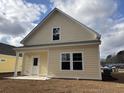 Backyard featuring a freshly seeded lawn and a covered patio at 3125 Tiger Tail Rd., Conway, SC 29526