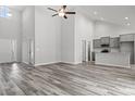 Open-concept living room with high ceilings and hardwood floors at 379 Lifestyle Court, Surfside Beach, SC 29575