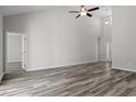 Spacious living area with hardwood floors and access to other rooms at 379 Lifestyle Court, Surfside Beach, SC 29575