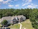 Aerial view of the property with mature trees, showing its location and ample green space at 4390 Daphne Ln. # H, Murrells Inlet, SC 29576
