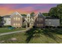 Inviting exterior of a brick and siding two-story building, complete with a well-maintained lawn and landscaping at 4390 Daphne Ln. # H, Murrells Inlet, SC 29576