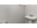 Elegant half-bathroom with a pedestal sink, chrome fixtures, and neutral wall color at 748 Rupert Dr, Conway, SC 29526