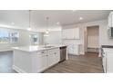 Modern kitchen featuring white cabinets, stainless steel appliances, and a spacious island at 748 Rupert Dr, Conway, SC 29526