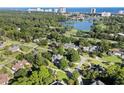 An aerial view of a residential community with lake, golf course and ocean views in the background at 9325 Cove Dr., Myrtle Beach, SC 29572