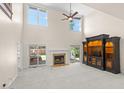 Bright living room with a fireplace, sliding glass doors and custom built-in entertainment center at 9325 Cove Dr., Myrtle Beach, SC 29572