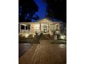Charming house exterior with a welcoming front porch and landscaped yard at 1612 Edge Dr., North Myrtle Beach, SC 29582