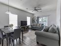 Open concept living and dining area with neutral decor and plenty of natural light throughout at 2060 Cross Gate Blvd. # 305, Surfside Beach, SC 29575