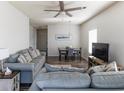 Cozy living room with sofa and dining area with modern lighting for comfortable living and entertaining at 2060 Cross Gate Blvd. # 305, Surfside Beach, SC 29575