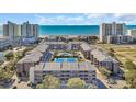 Panoramic aerial view showcasing the condo complex's pool, tennis court, and proximity to the beach at 212 2Nd Ave. N # 364, North Myrtle Beach, SC 29582