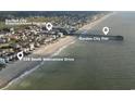 Aerial view featuring Garden City Pier, entertainment district, and 328 South Waccamaw Drive at 328 S Waccamaw Dr., Garden City Beach, SC 29576